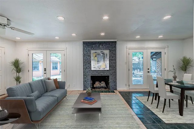 a living room with furniture fireplace and window