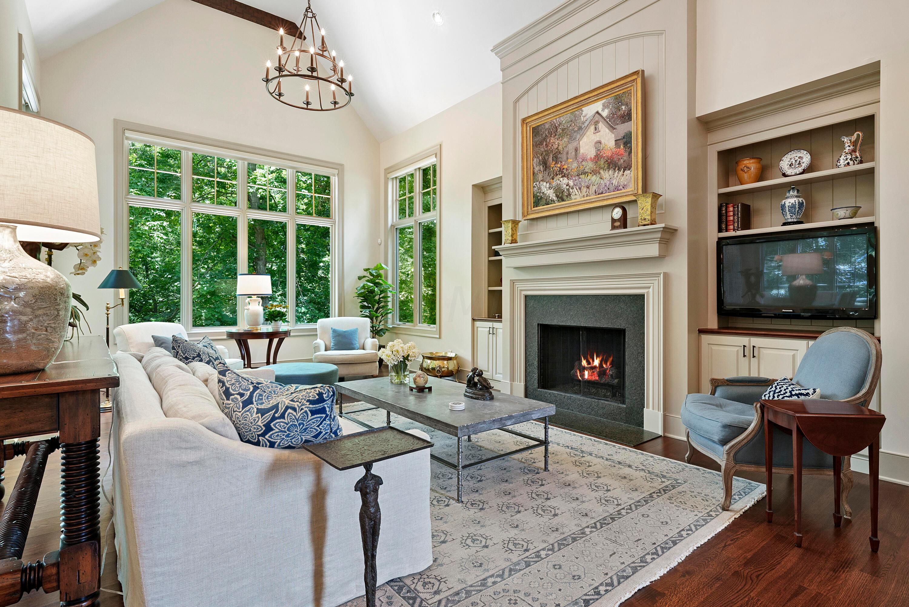 2730 Edington Road Columbus, OH 43221 - Photo 9 of 70 Gas fireplace and built-in custom cabinetry.
