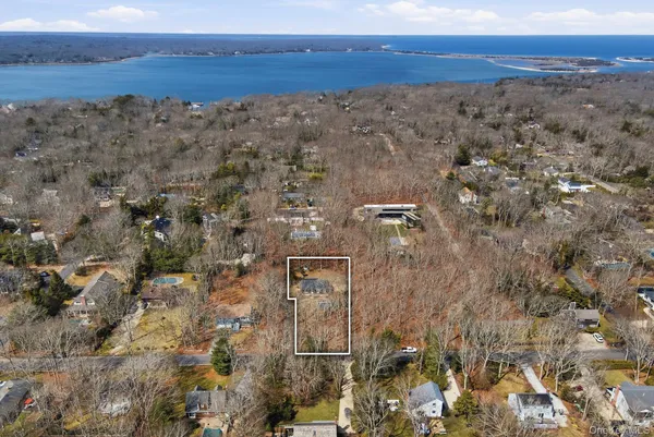 an aerial view of house with yard