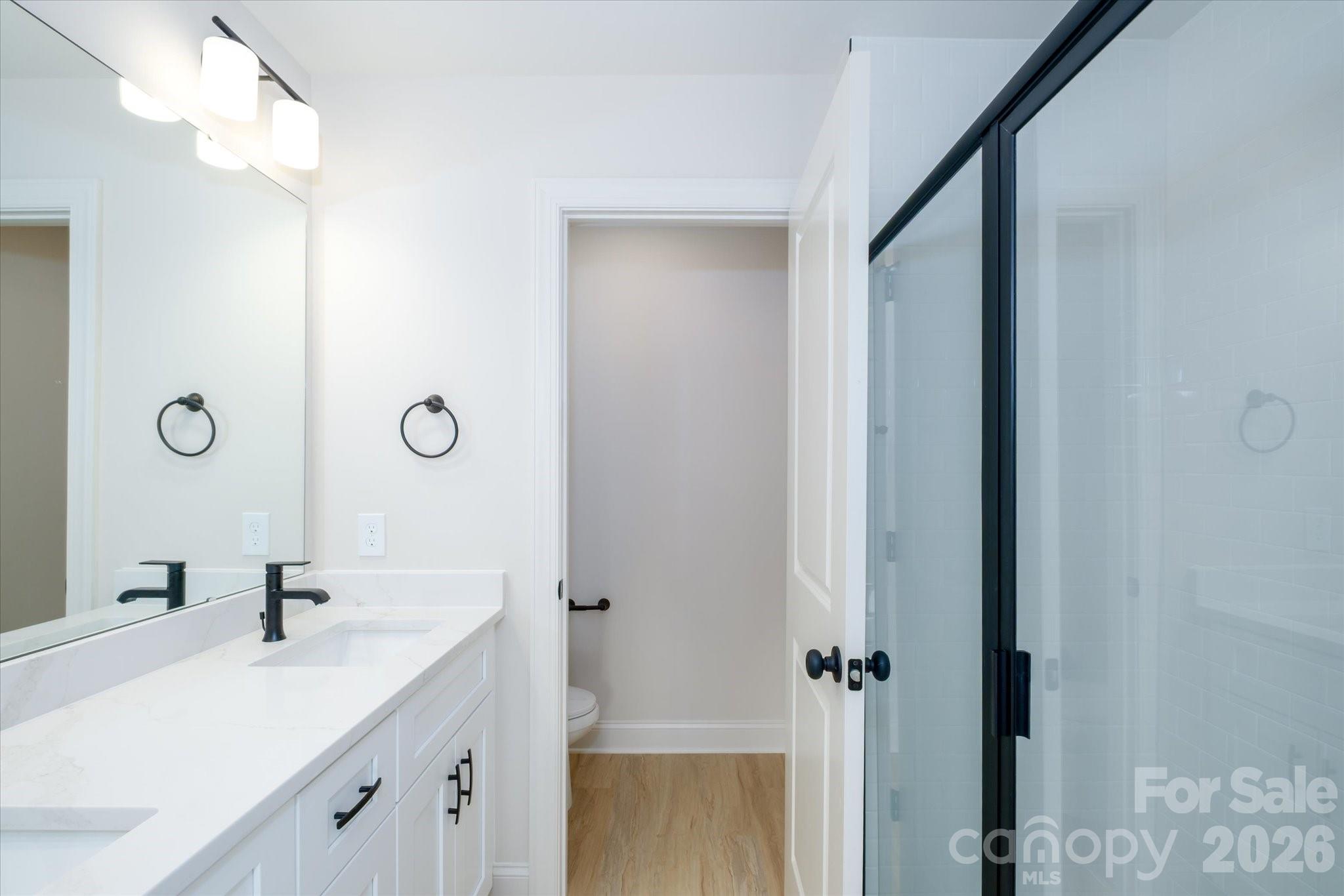 1816 East Greenbriar Road Statesville, NC 28625 - Photo 14 of 34 a bathroom with a double vanity sink and mirror