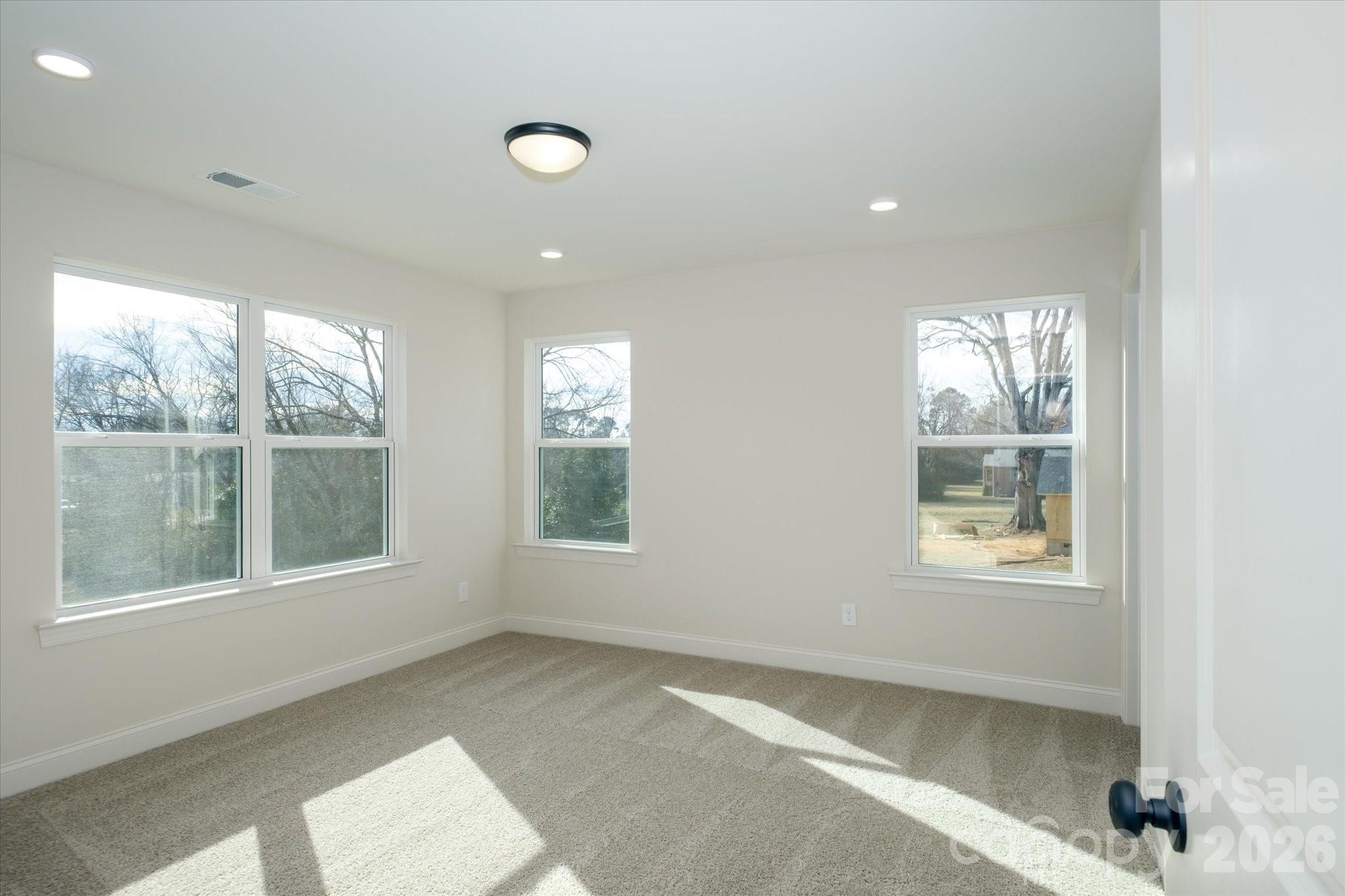 1816 East Greenbriar Road Statesville, NC 28625 - Photo 16 of 34 a view of an empty room with a window