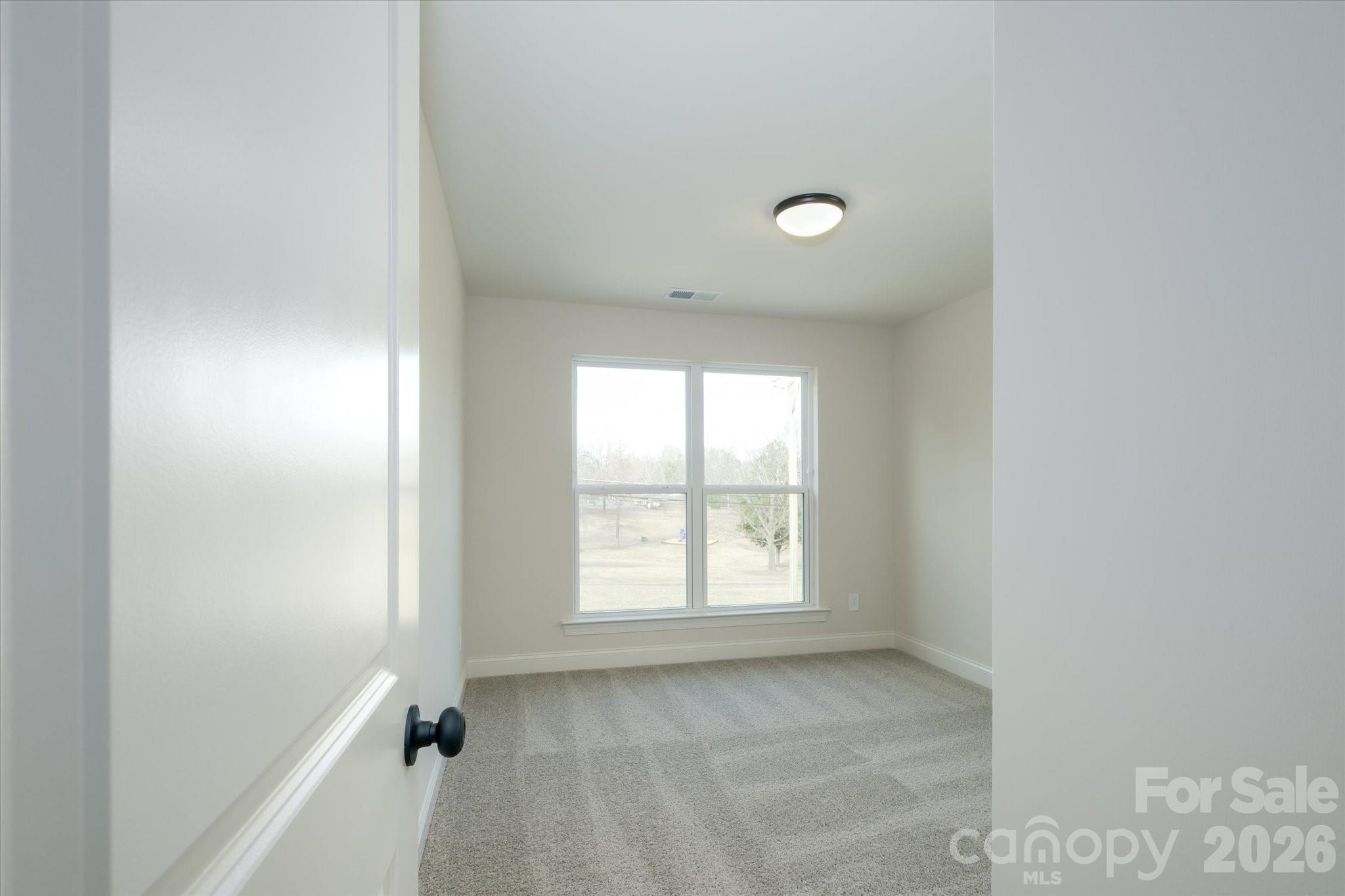 1816 East Greenbriar Road Statesville, NC 28625 - Photo 21 of 34 a view of an empty room with a window