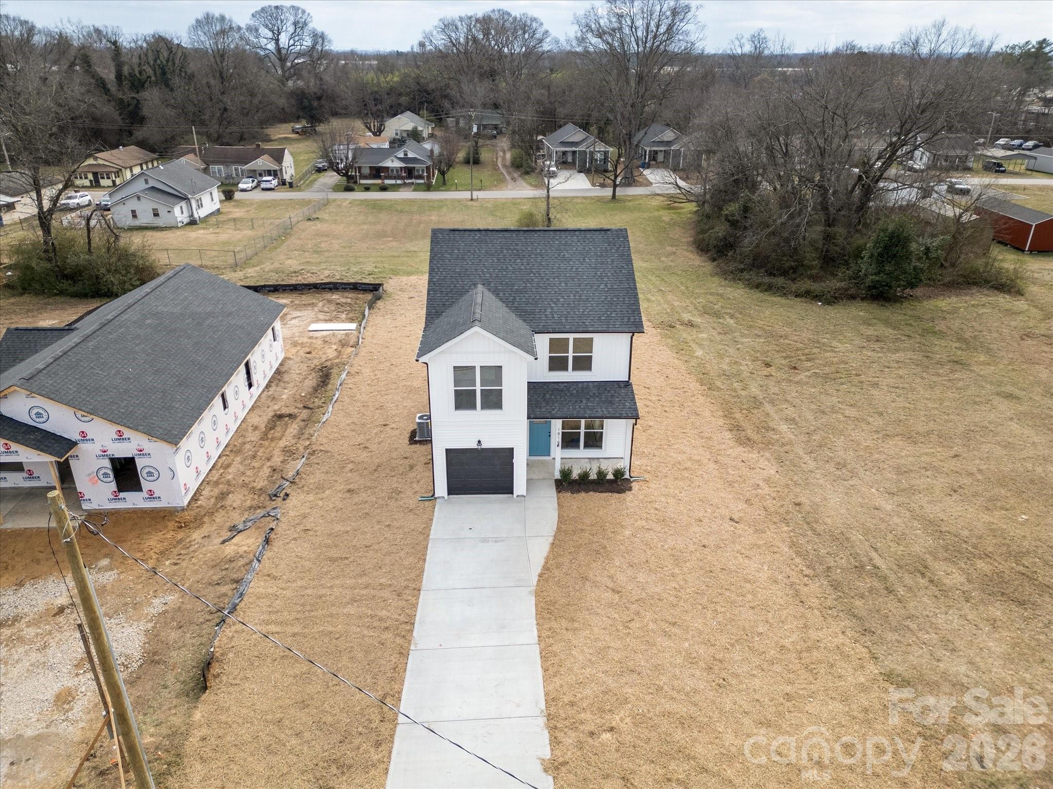 1816 East Greenbriar Road Statesville, NC 28625 - Photo 23 of 34 a view of a house with pool and trees in the background
