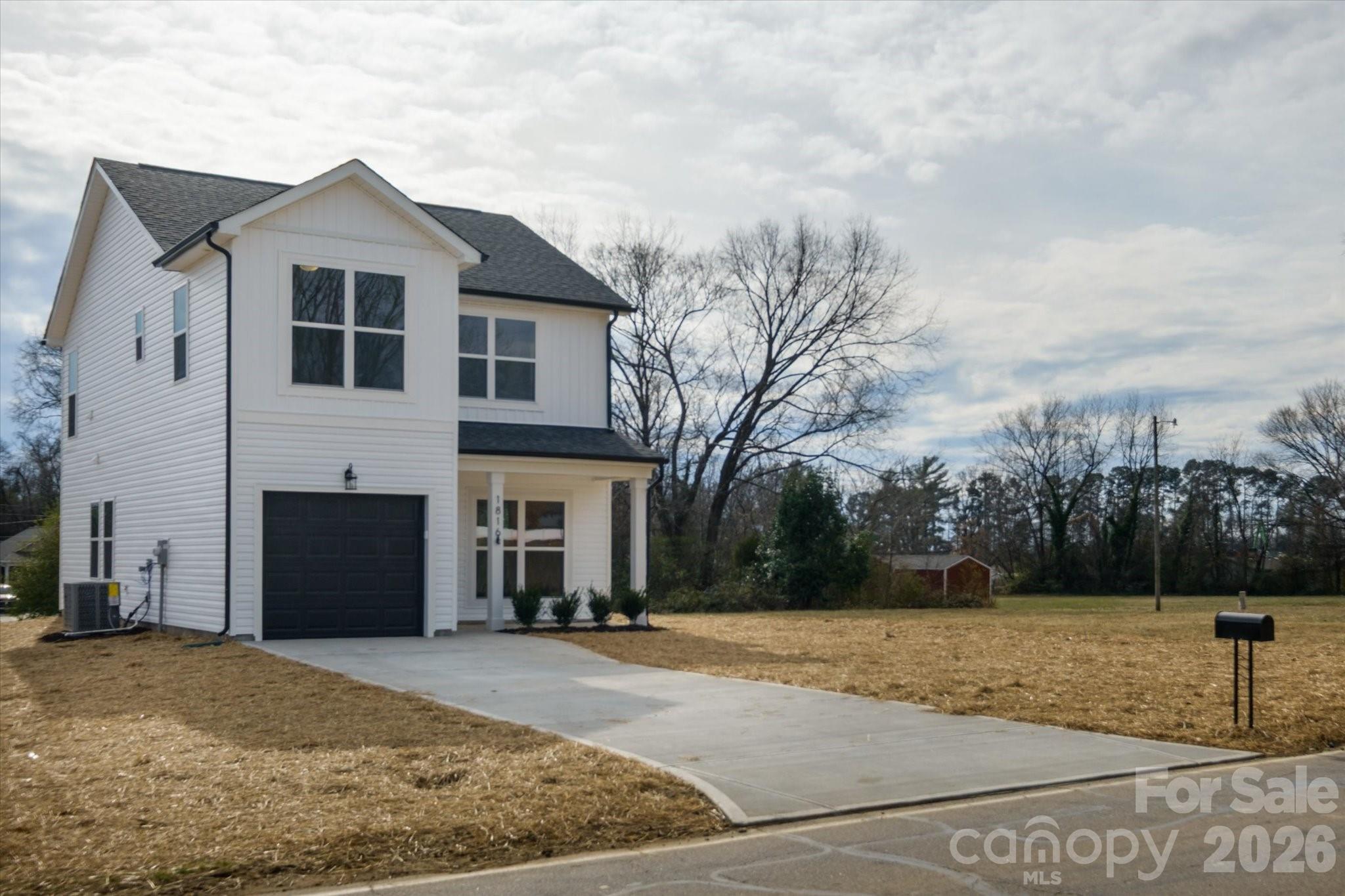 1816 East Greenbriar Road Statesville, NC 28625 - Photo 24 of 34 a front view of a house with a yard