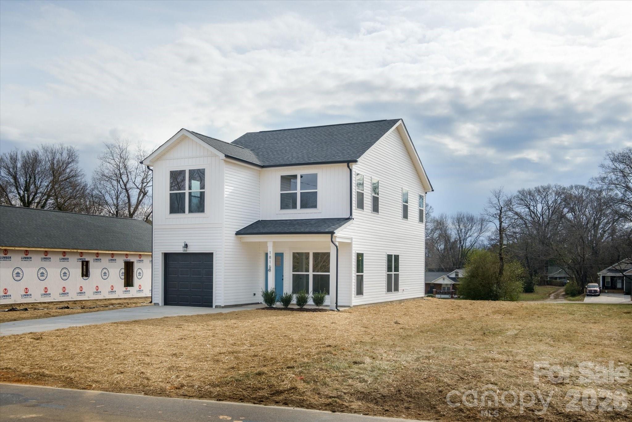 1816 East Greenbriar Road Statesville, NC 28625 - Photo 25 of 34 a front view of a house with a yard and garage