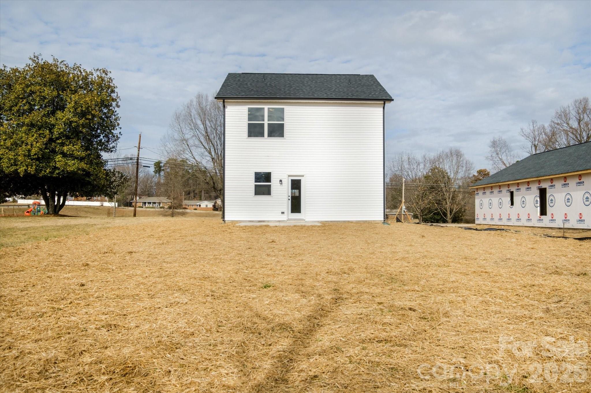 1816 East Greenbriar Road Statesville, NC 28625 - Photo 26 of 34 a view of large house with a yard