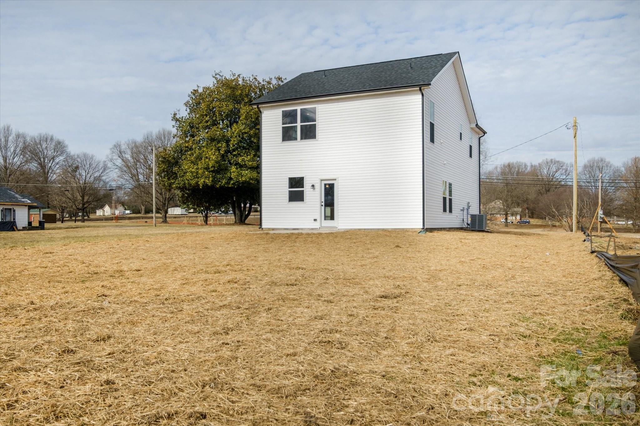 1816 East Greenbriar Road Statesville, NC 28625 - Photo 30 of 34 a view of a house with a yard