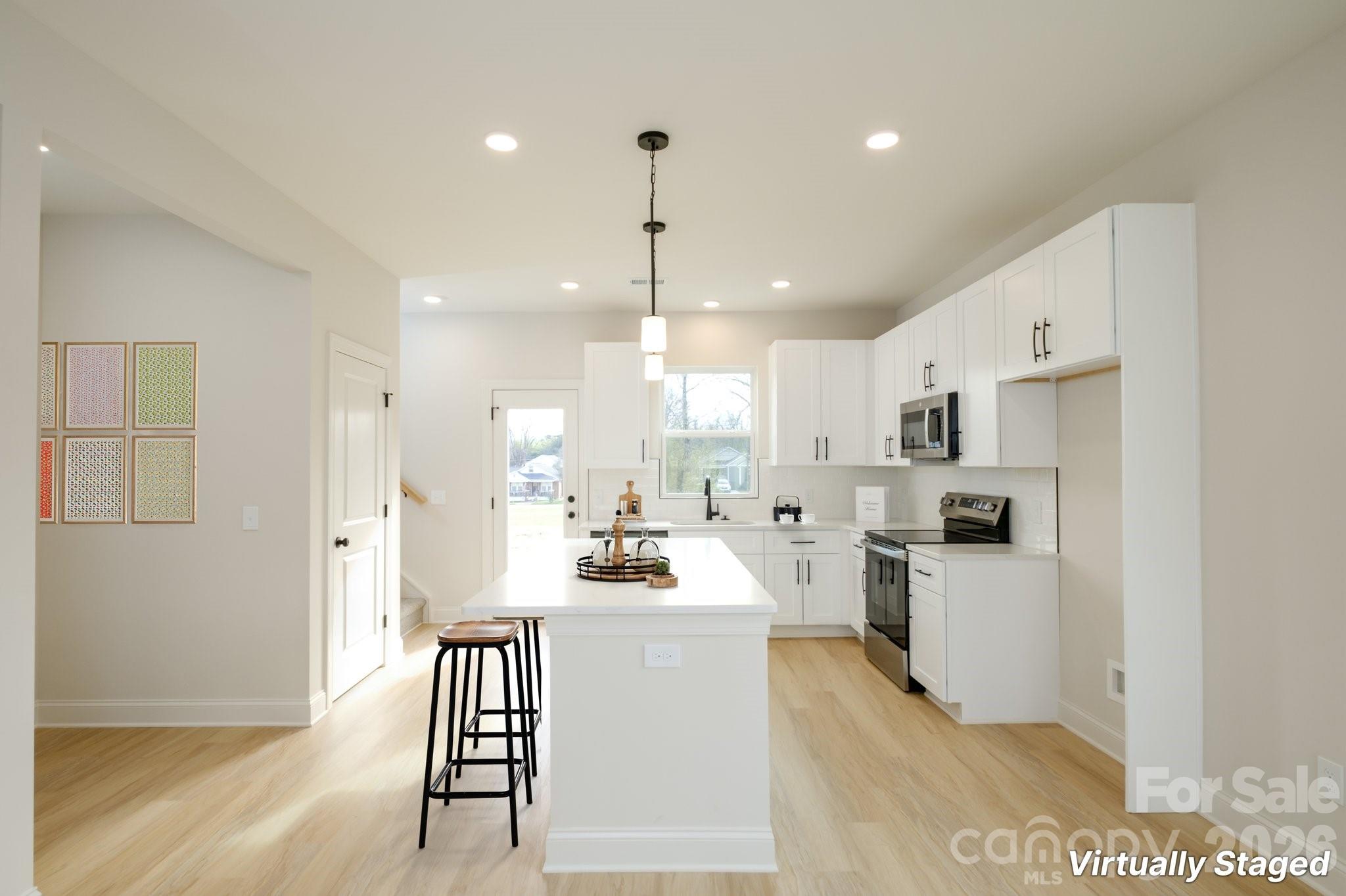 1816 East Greenbriar Road Statesville, NC 28625 - Photo 3 of 34 a kitchen with refrigerator cabinets and stove