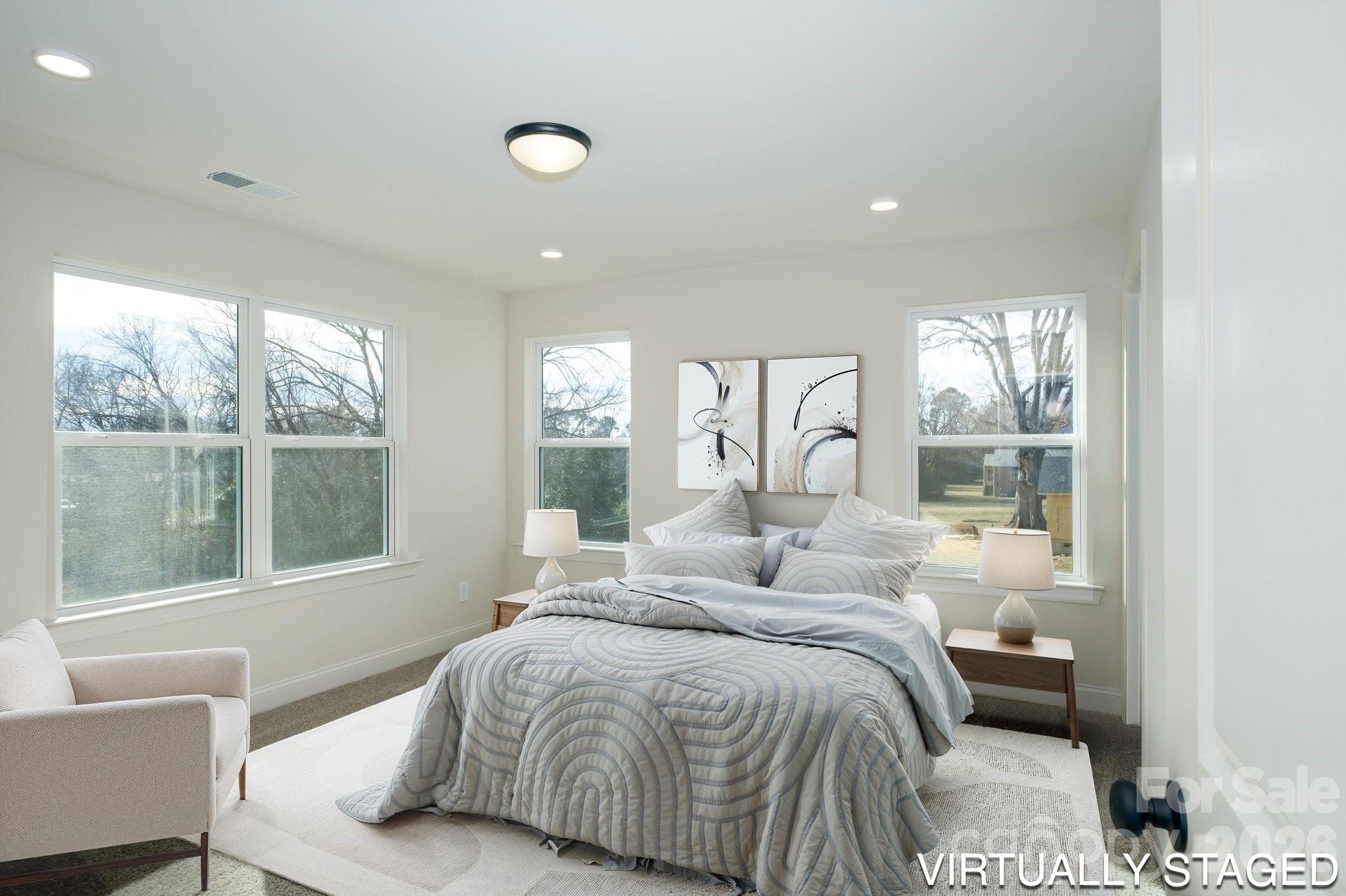 1816 East Greenbriar Road Statesville, NC 28625 - Photo 4 of 34 a bedroom with a large bed and a large window