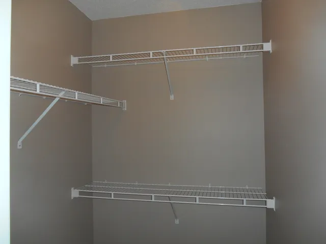 a bathroom with a toilet a sink and a mirror