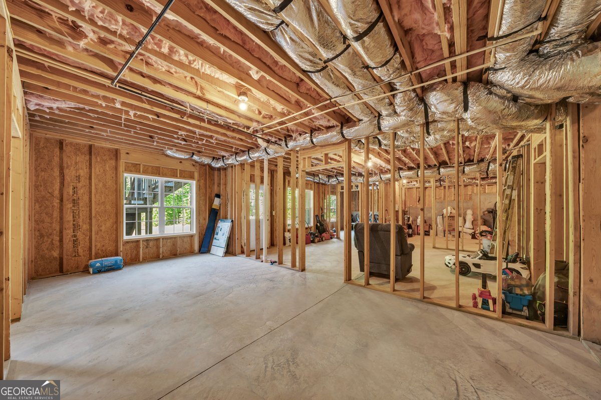 2594 Lassiter Road Forsyth, GA 31029 - Photo 24 of 28 a view of a room with wooden walls