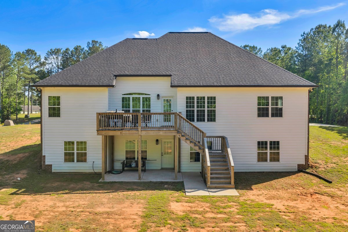 2594 Lassiter Road Forsyth, GA 31029 - Photo 26 of 28 a house view with a outdoor space