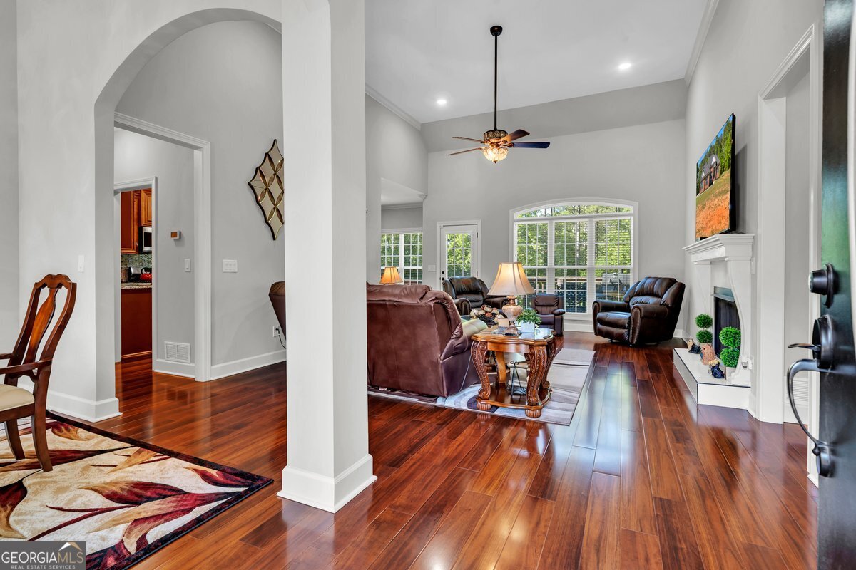 2594 Lassiter Road Forsyth, GA 31029 - Photo 3 of 28 a view of a dining room with furniture window and wooden floor