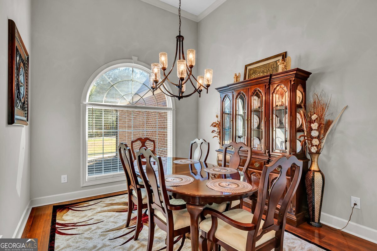 2594 Lassiter Road Forsyth, GA 31029 - Photo 10 of 28 a view of a dining room with furniture and window