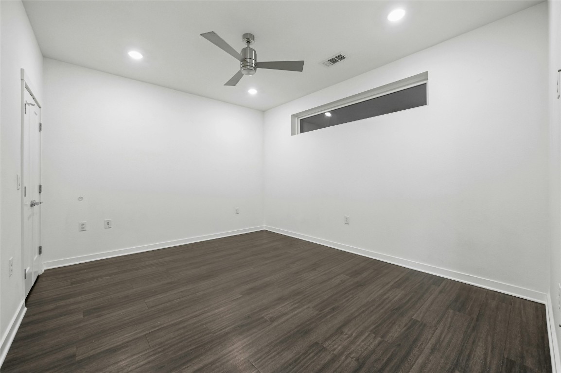 4361 South Congress Avenue, Unit 129 Austin, TX 78745 - Photo 14 of 25 wooden floor in an empty room
