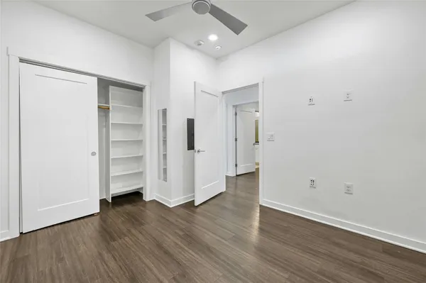an empty room with wooden floor
