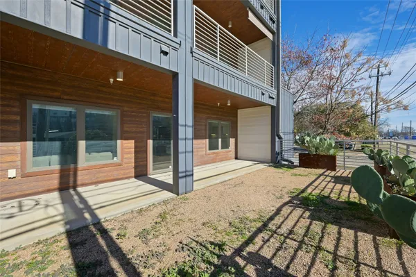 a view of a backyard with sitting area
