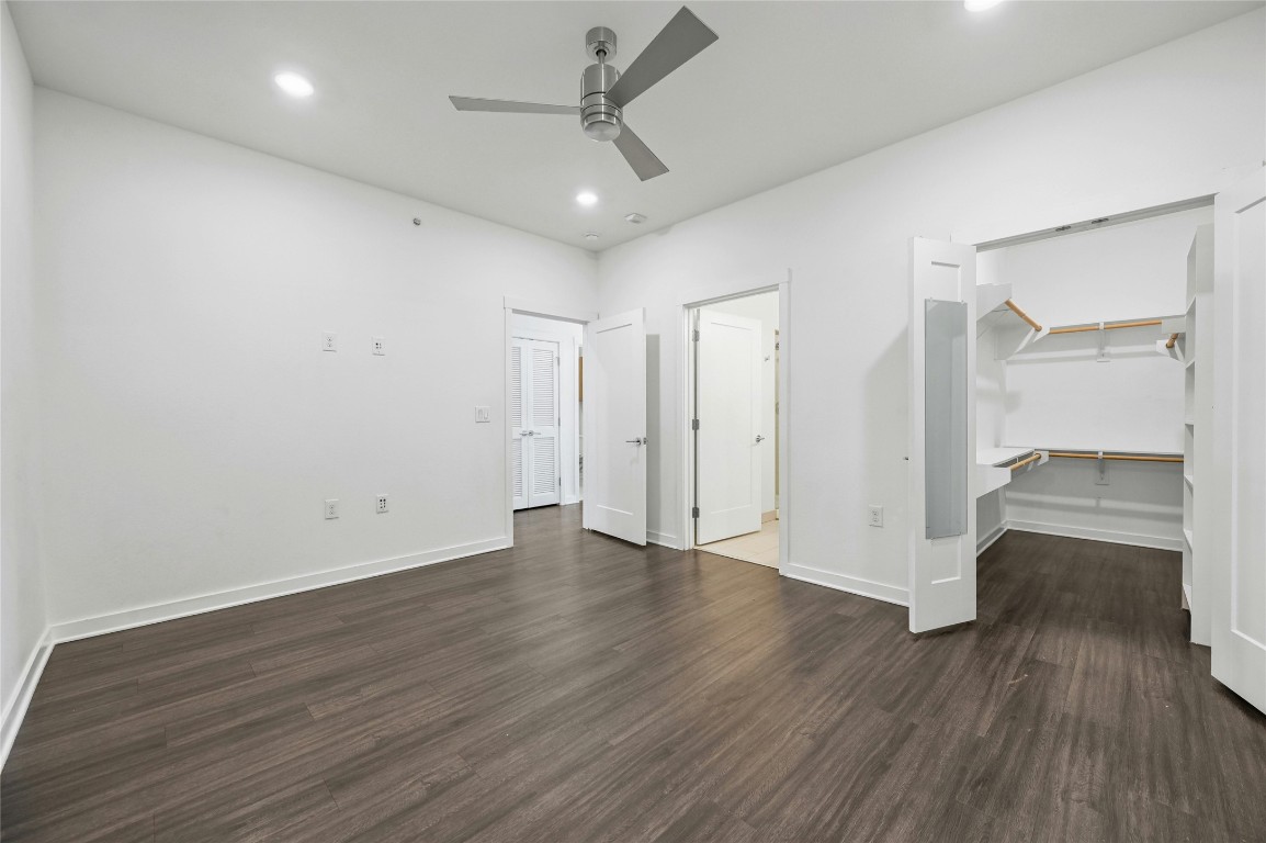 4361 South Congress Avenue, Unit 129 Austin, TX 78745 - Photo 6 of 25 a view of an empty room with wooden floor