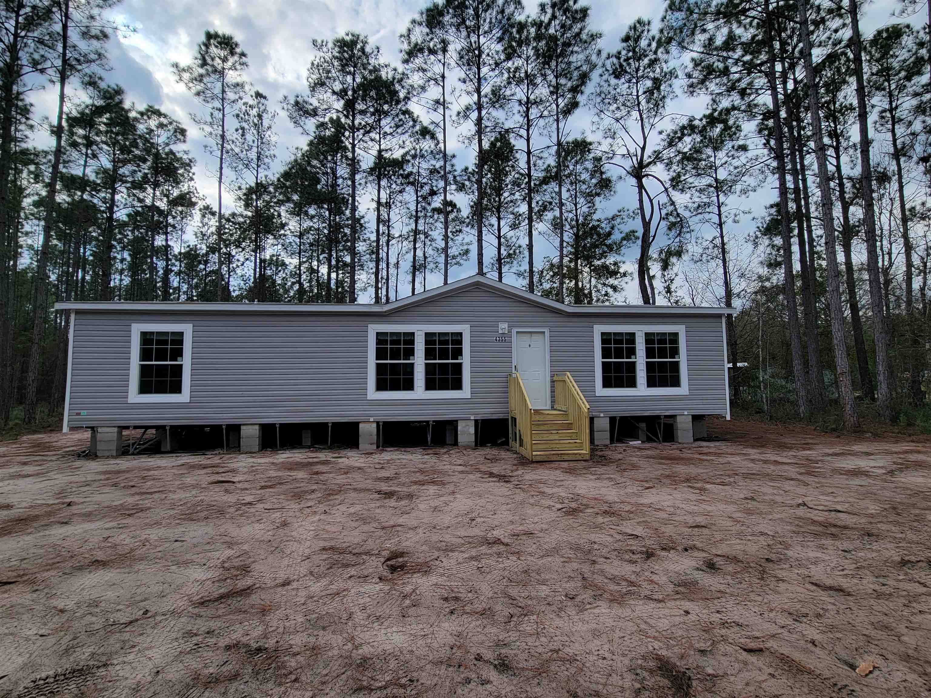 4355 Joyce Street Hastings, FL 32145 - Photo 2 of 12 a view of a house with a yard