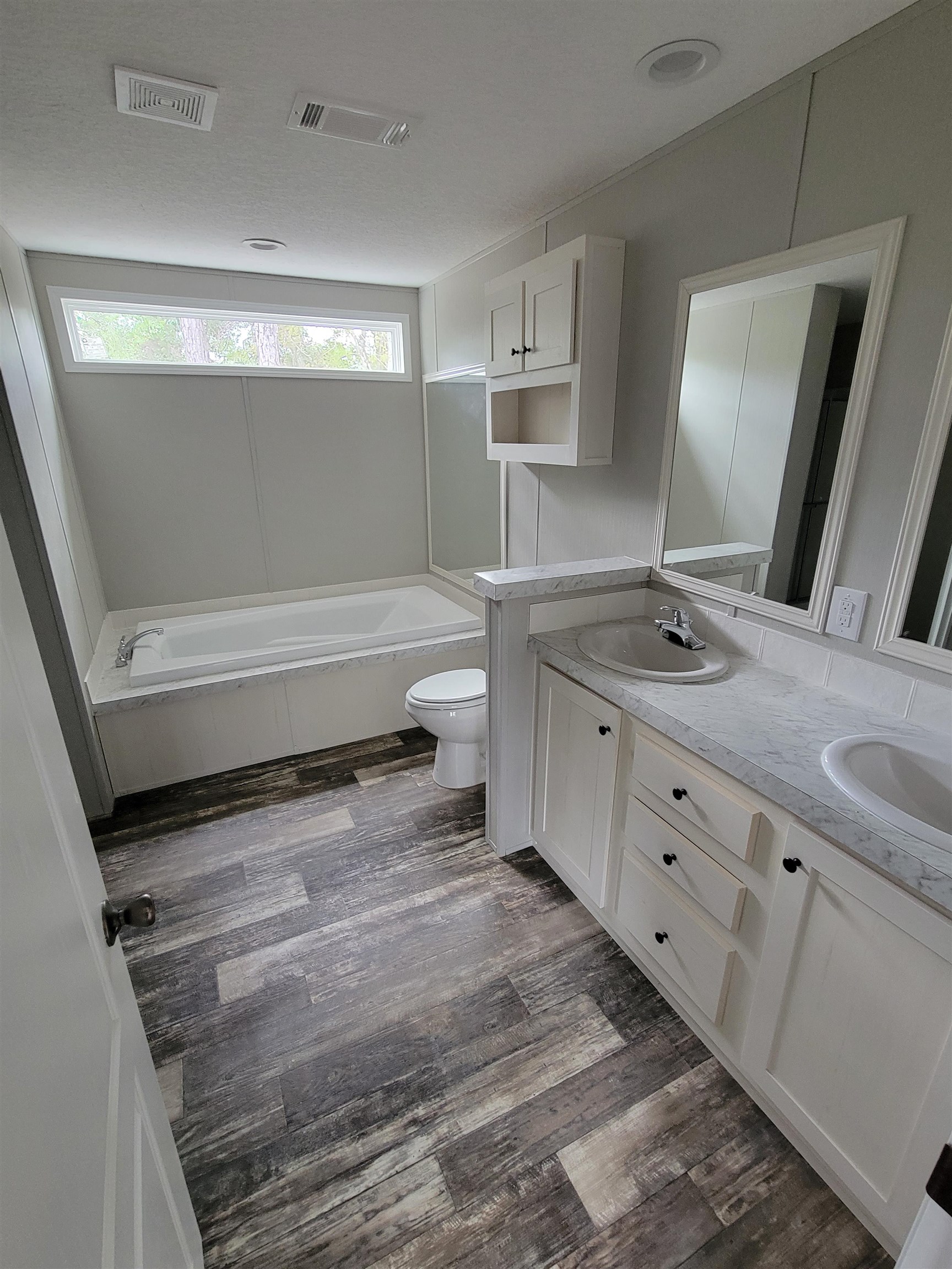 4355 Joyce Street Hastings, FL 32145 - Photo 5 of 12 a bathroom with a sink and a mirror