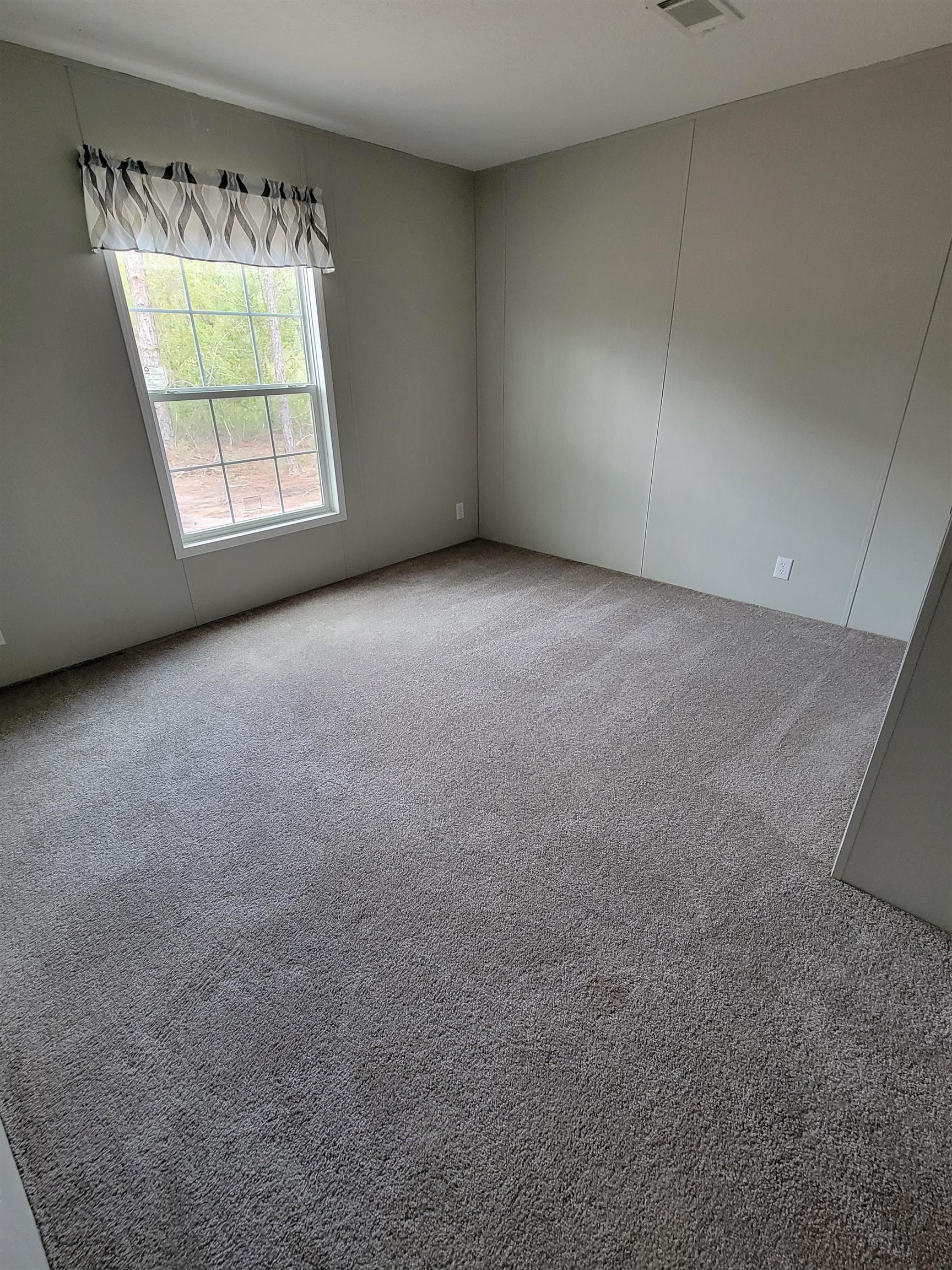 4355 Joyce Street Hastings, FL 32145 - Photo 10 of 12 an empty room with a window