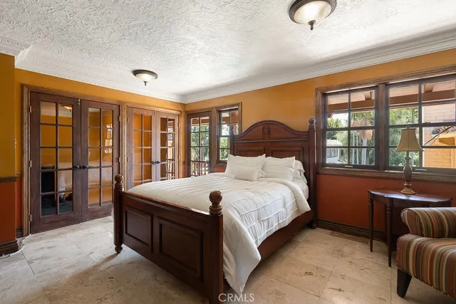 a bedroom with a large bed and a couch