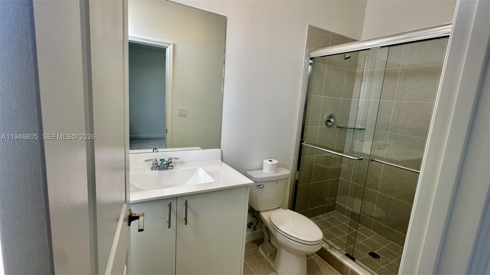 2713 Southeast 26th Road Homestead, FL 33035 - Photo 16 of 27 a bathroom with a sink toilet and shower