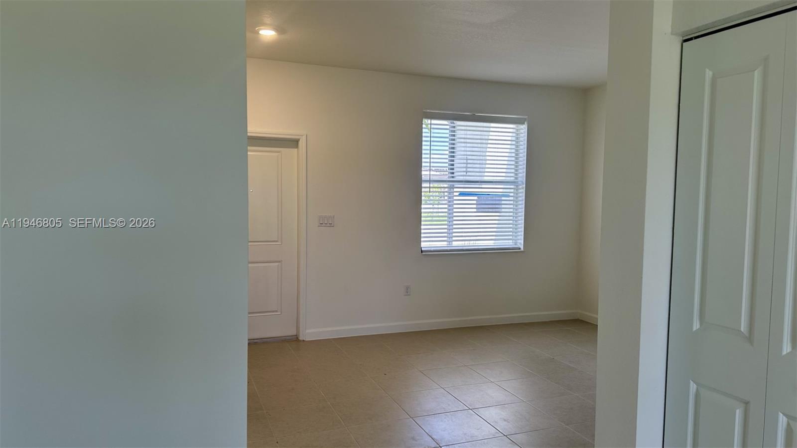 2713 Southeast 26th Road Homestead, FL 33035 - Photo 20 of 27 an empty room with windows