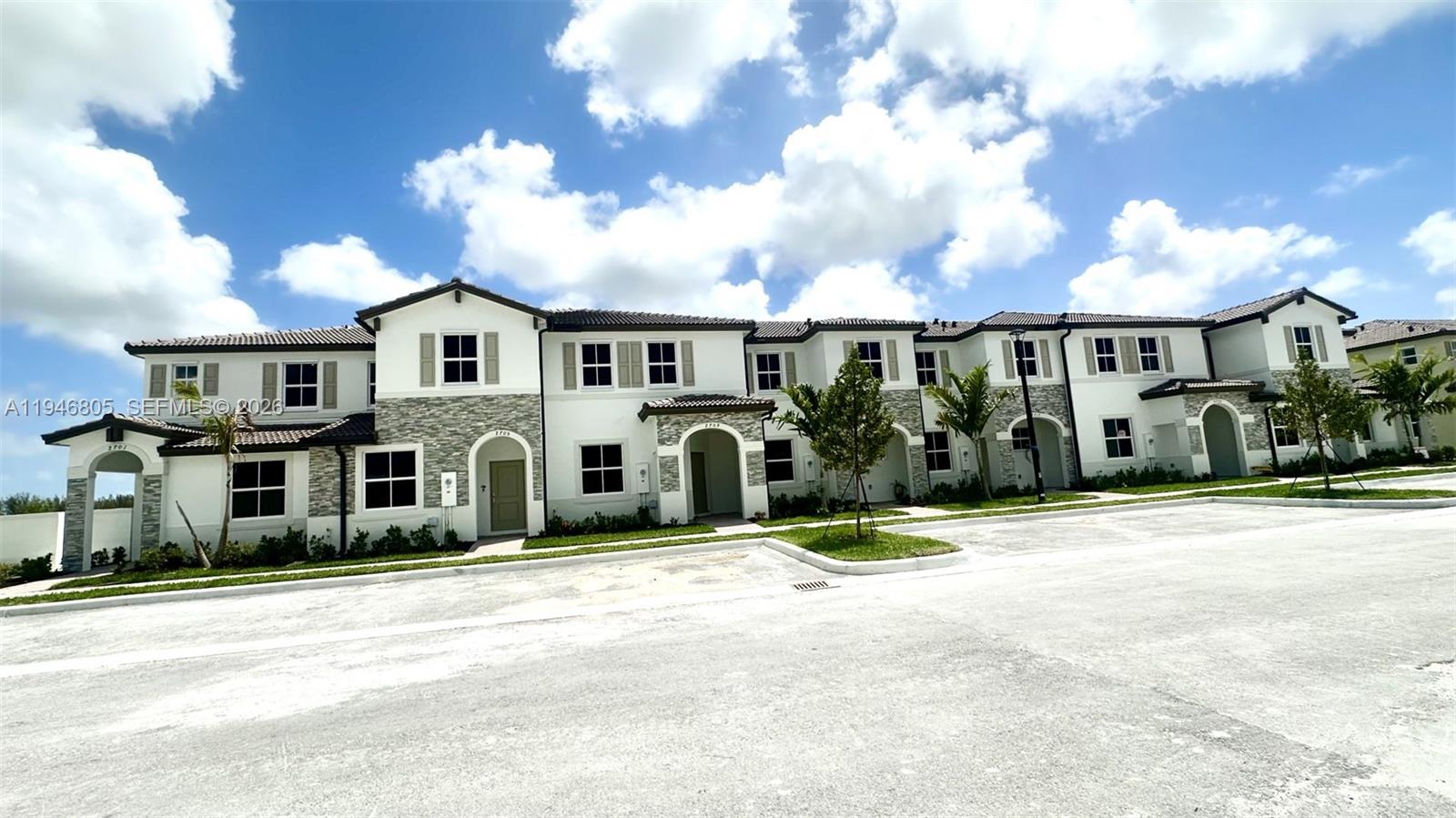 2713 Southeast 26th Road Homestead, FL 33035 - Photo 2 of 27 front view of a house with a street