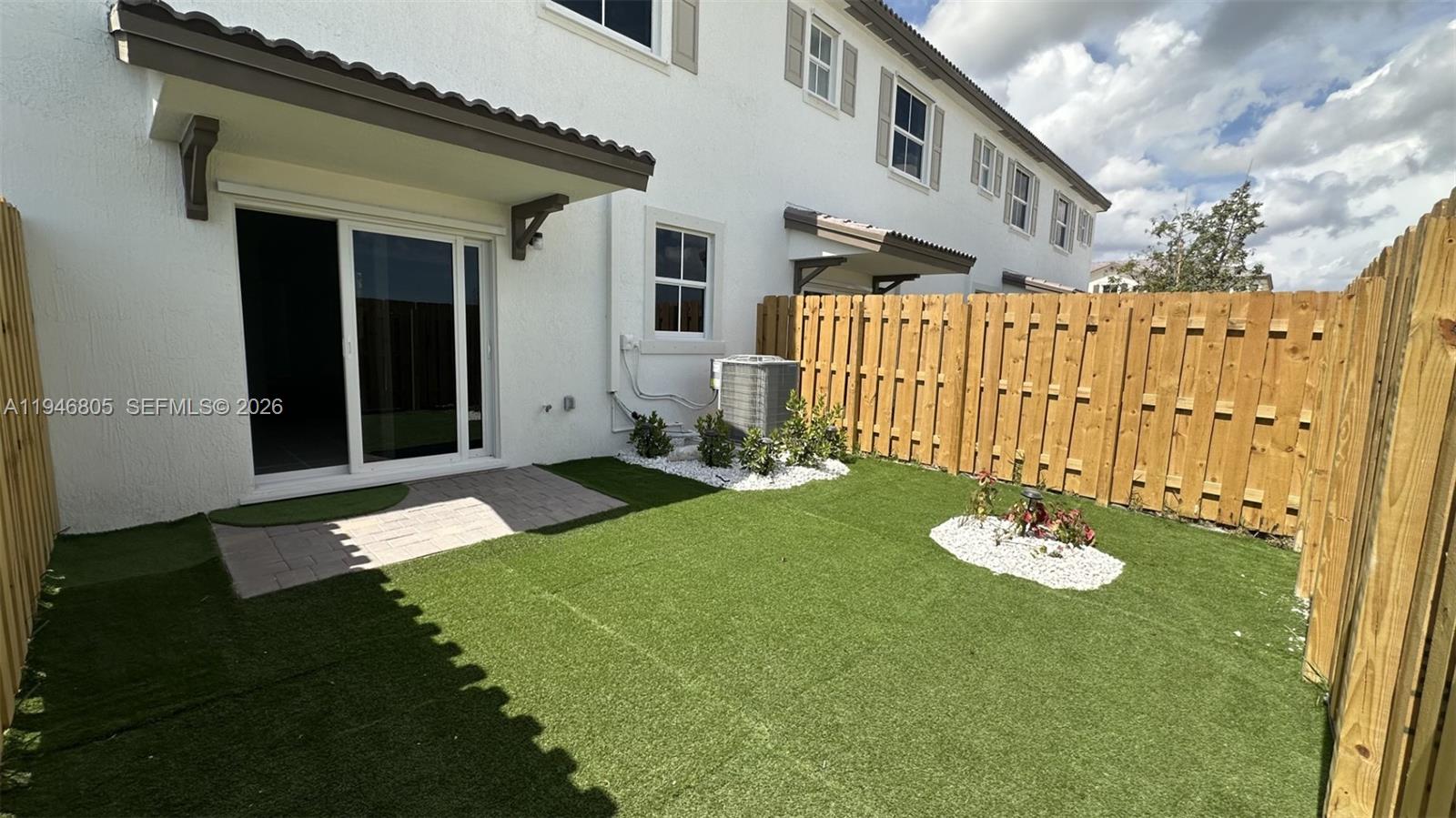 2713 Southeast 26th Road Homestead, FL 33035 - Photo 25 of 27 a view of a house with backyard and sitting area