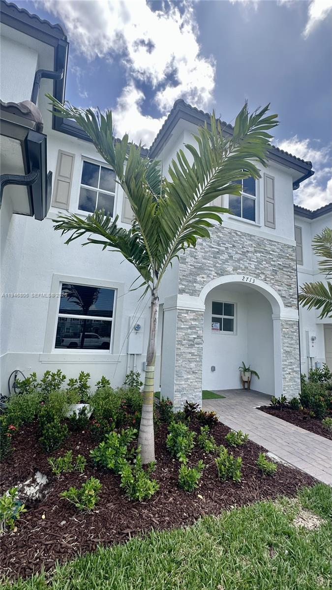 2713 Southeast 26th Road Homestead, FL 33035 - Photo 27 of 27 a front view of a house with a garden