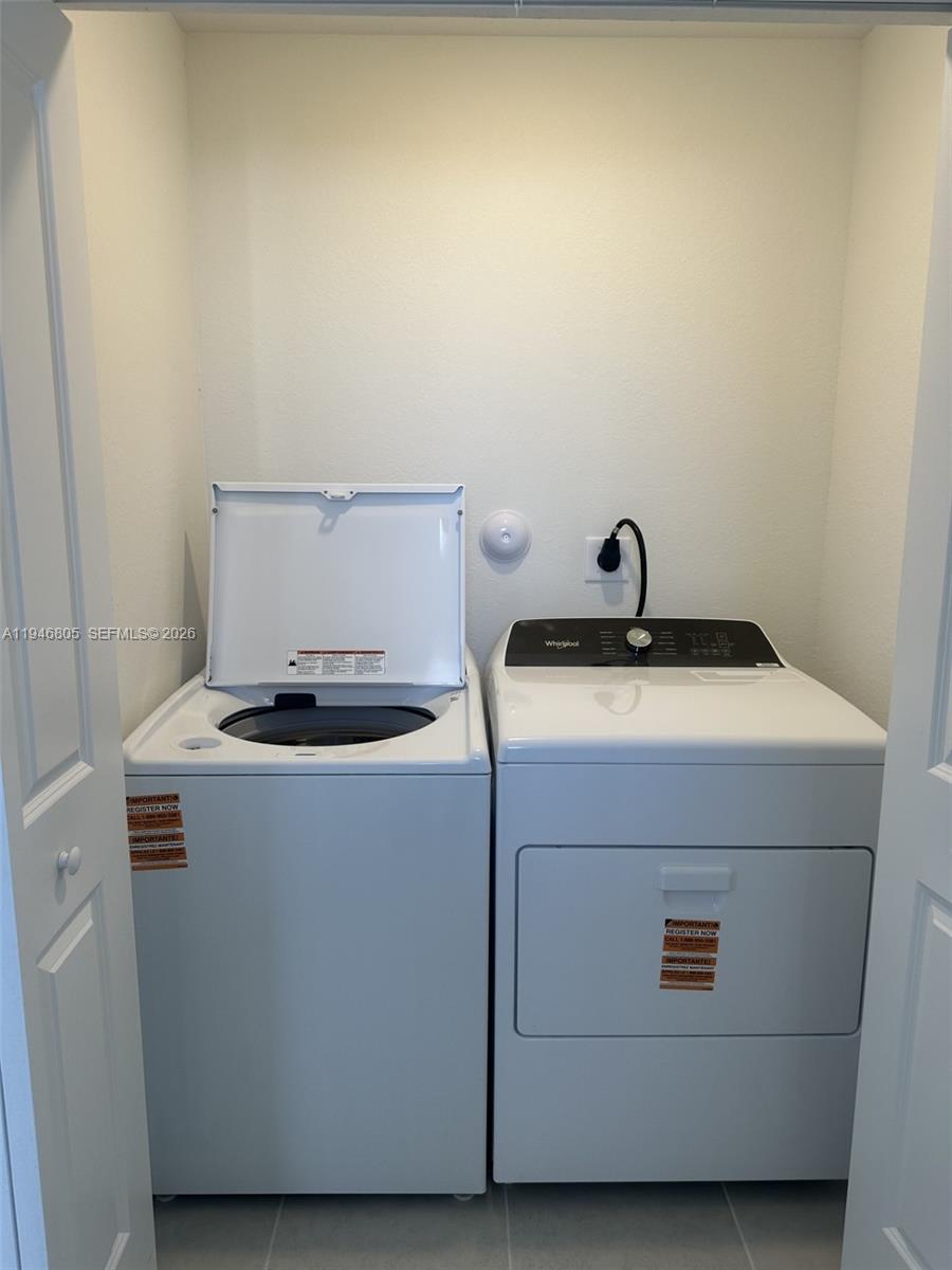 2713 Southeast 26th Road Homestead, FL 33035 - Photo 8 of 27 a utility room with dryer and washer