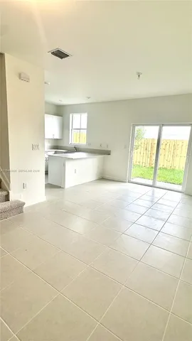 a large white room with a large window