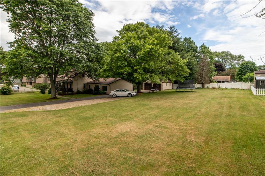 1664 Brodhead Road Coraopolis, PA 15108 - Photo 3 of 25 Side of house with more yard space. Such a fantastic space with greenery surrounding the home.