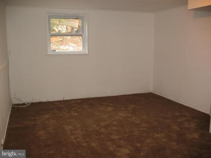 5403 Littleford Street Springfield, VA 22151 - Photo 12 of 21 an empty room with a window