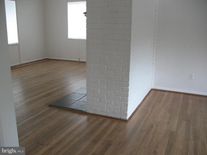 5403 Littleford Street Springfield, VA 22151 - Photo 13 of 21 an empty room with wooden floor and windows