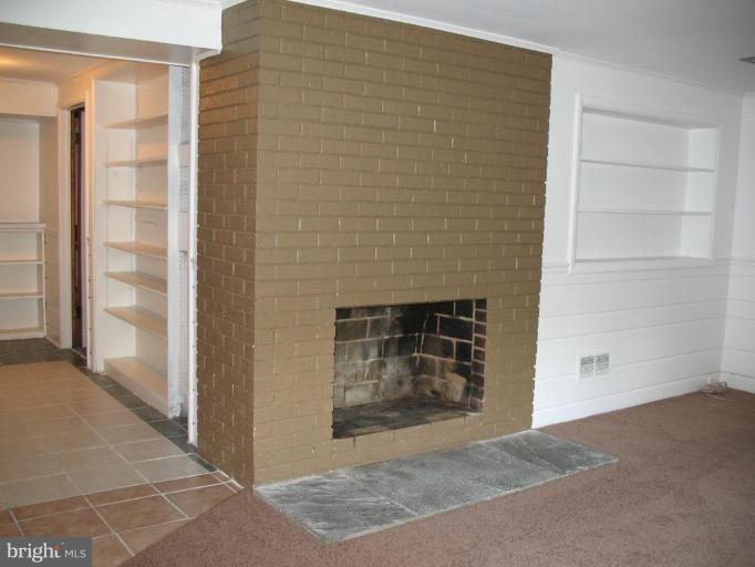 5403 Littleford Street Springfield, VA 22151 - Photo 19 of 21 a view of an empty room and fire place