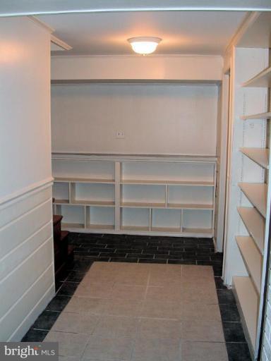 5403 Littleford Street Springfield, VA 22151 - Photo 21 of 21 a view of walk in closet with empty racks