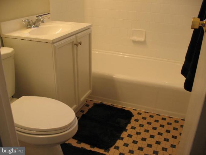 5403 Littleford Street Springfield, VA 22151 - Photo 7 of 21 a bathroom with a sink toilet and shower