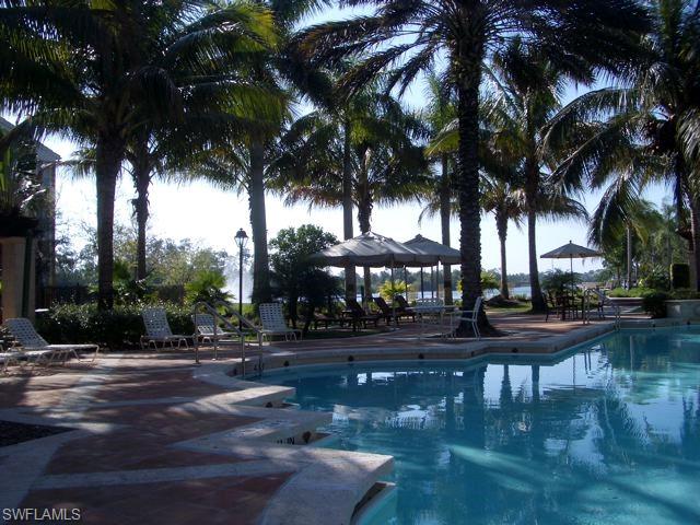 1210 Reserve Way, Unit 9203 Naples, FL 34105 - Photo 11 of 18 a view of a yard and tree s