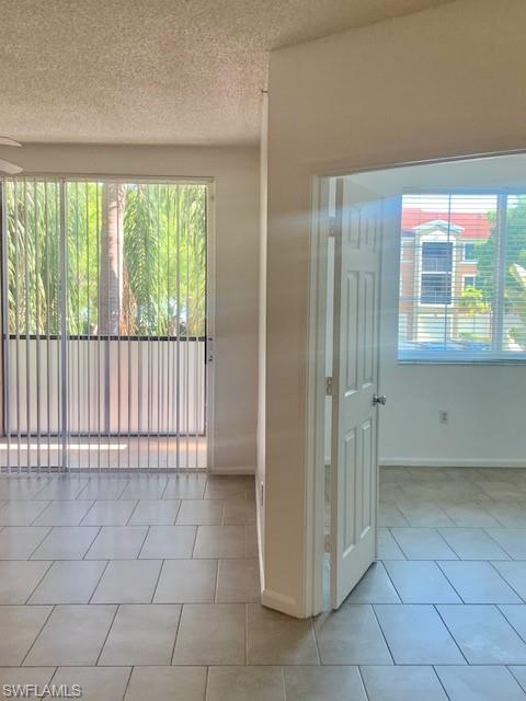 1210 Reserve Way, Unit 9203 Naples, FL 34105 - Photo 4 of 18 a view of a bathroom with a shower and a sink