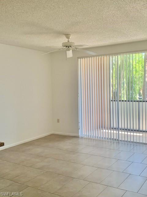 1210 Reserve Way, Unit 9203 Naples, FL 34105 - Photo 5 of 18 an empty room with a empty space and a window