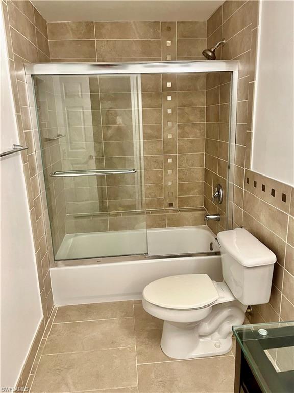1210 Reserve Way, Unit 9203 Naples, FL 34105 - Photo 7 of 18 a bathroom with a toilet and a shower