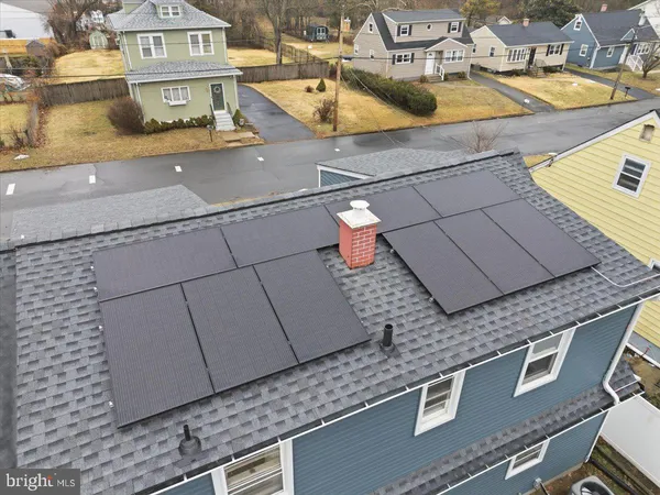 an aerial view of a house with swimming pool