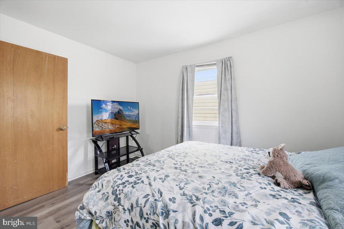 35 Rosedale Avenue Ewing, NJ 08638 - Photo 24 of 35 a bedroom with a bed and a table in it