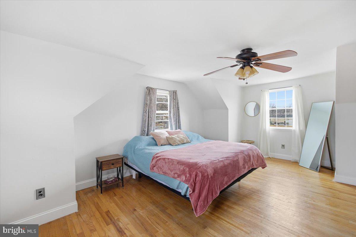 35 Rosedale Avenue Ewing, NJ 08638 - Photo 26 of 35 a bedroom with a bed a chandelier and a window