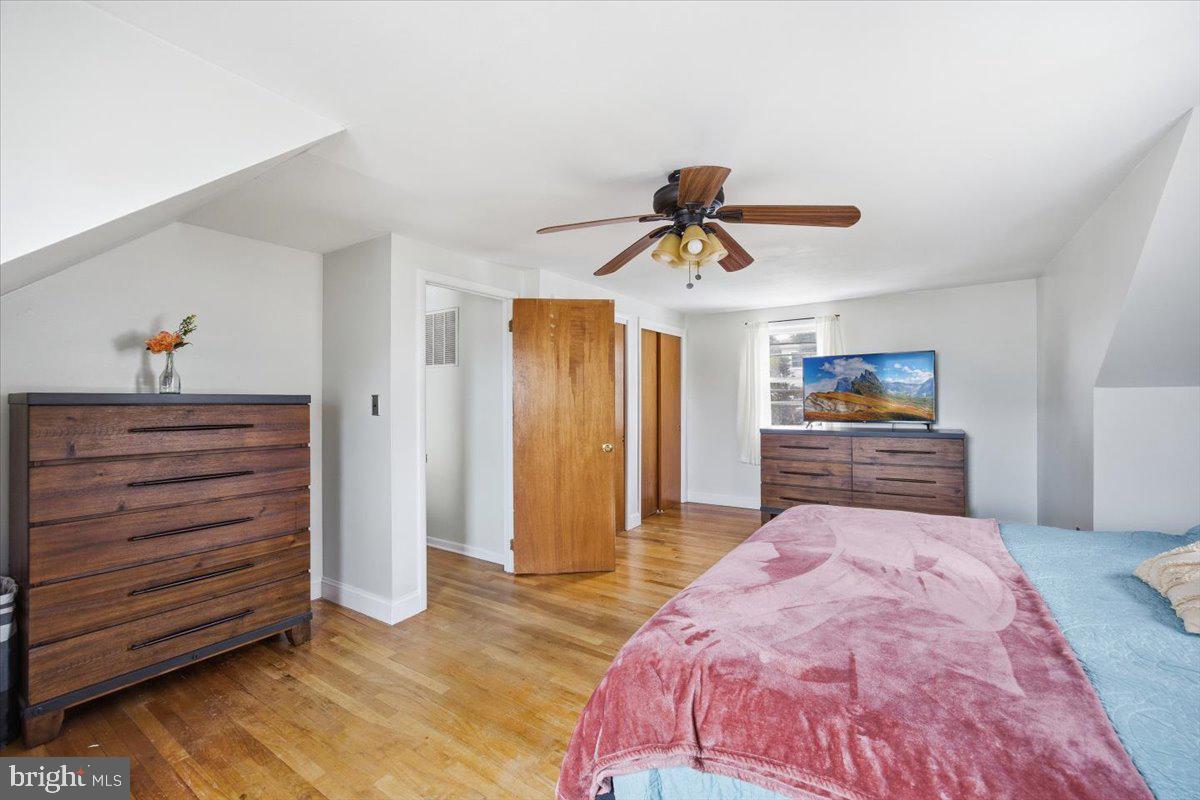 35 Rosedale Avenue Ewing, NJ 08638 - Photo 27 of 35 a bedroom with a bed and a chandelier