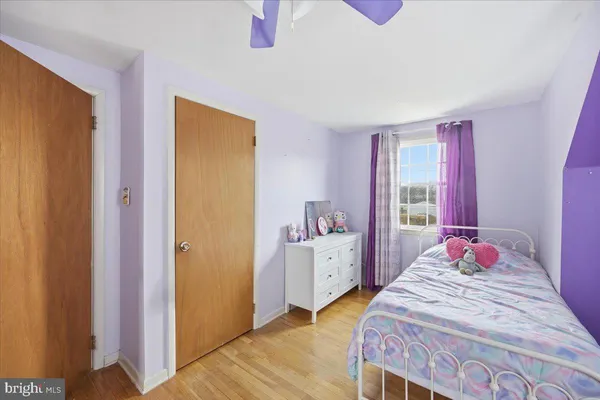 a bedroom with a bed and a closet