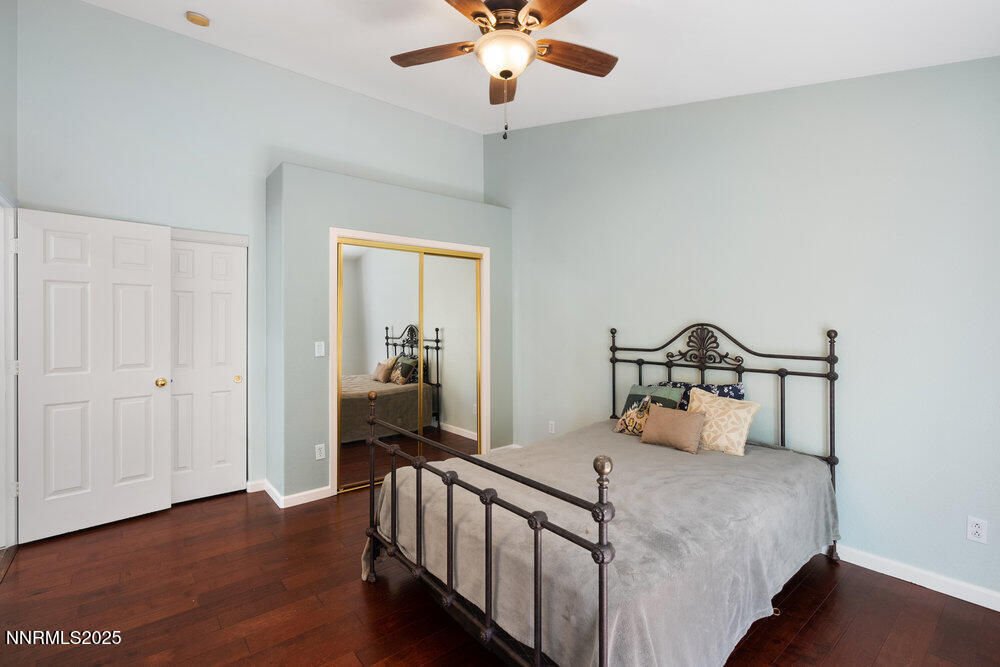 1706 River Gorge Court Reno, NV 89521 - Photo 15 of 40 a bedroom with a bed and a chandelier