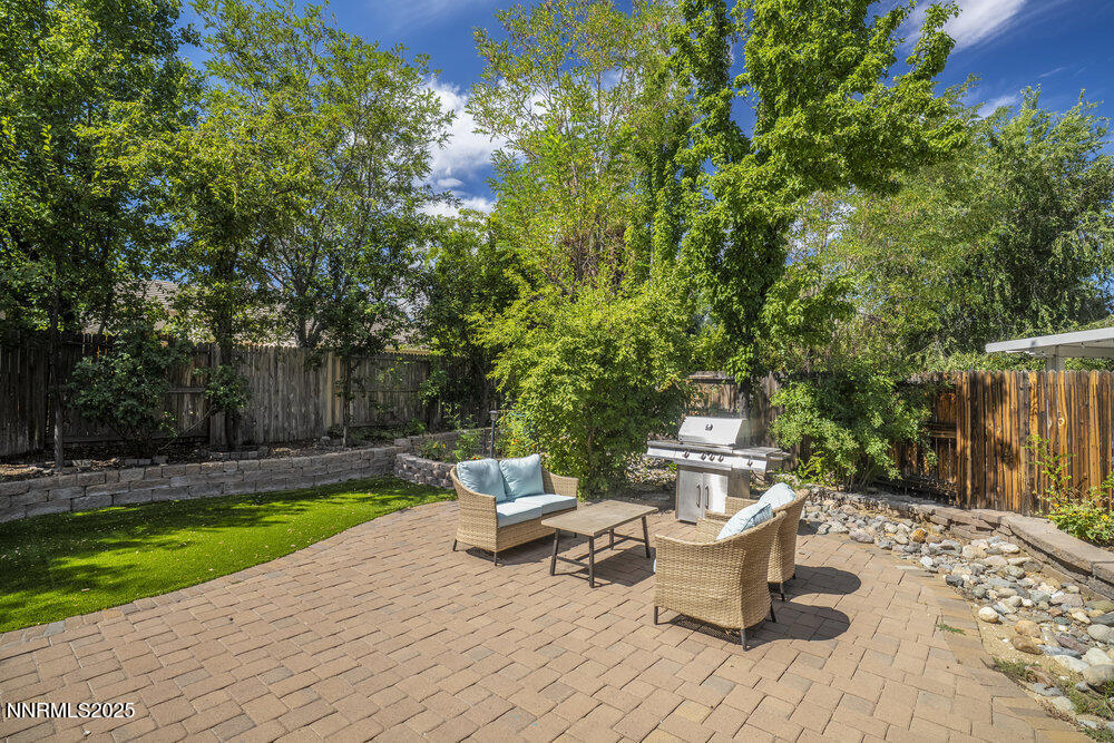 1706 River Gorge Court Reno, NV 89521 - Photo 34 of 40 a view of a backyard with sitting area